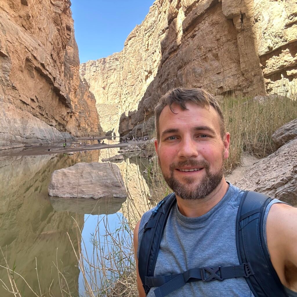 Health coach Gary Brandt hiking through a canyon